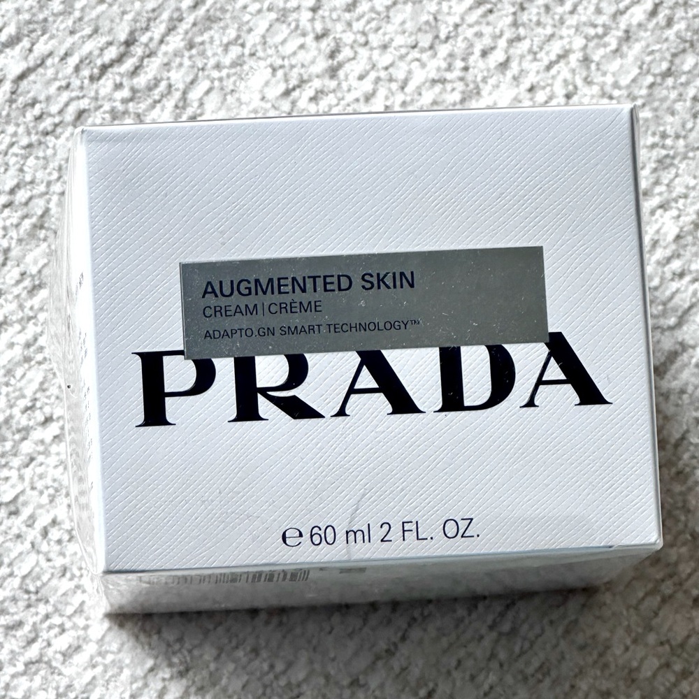 New PRADA Augmented Skin Cream 2 fl ounces. Never opened. Plastic wrapped.